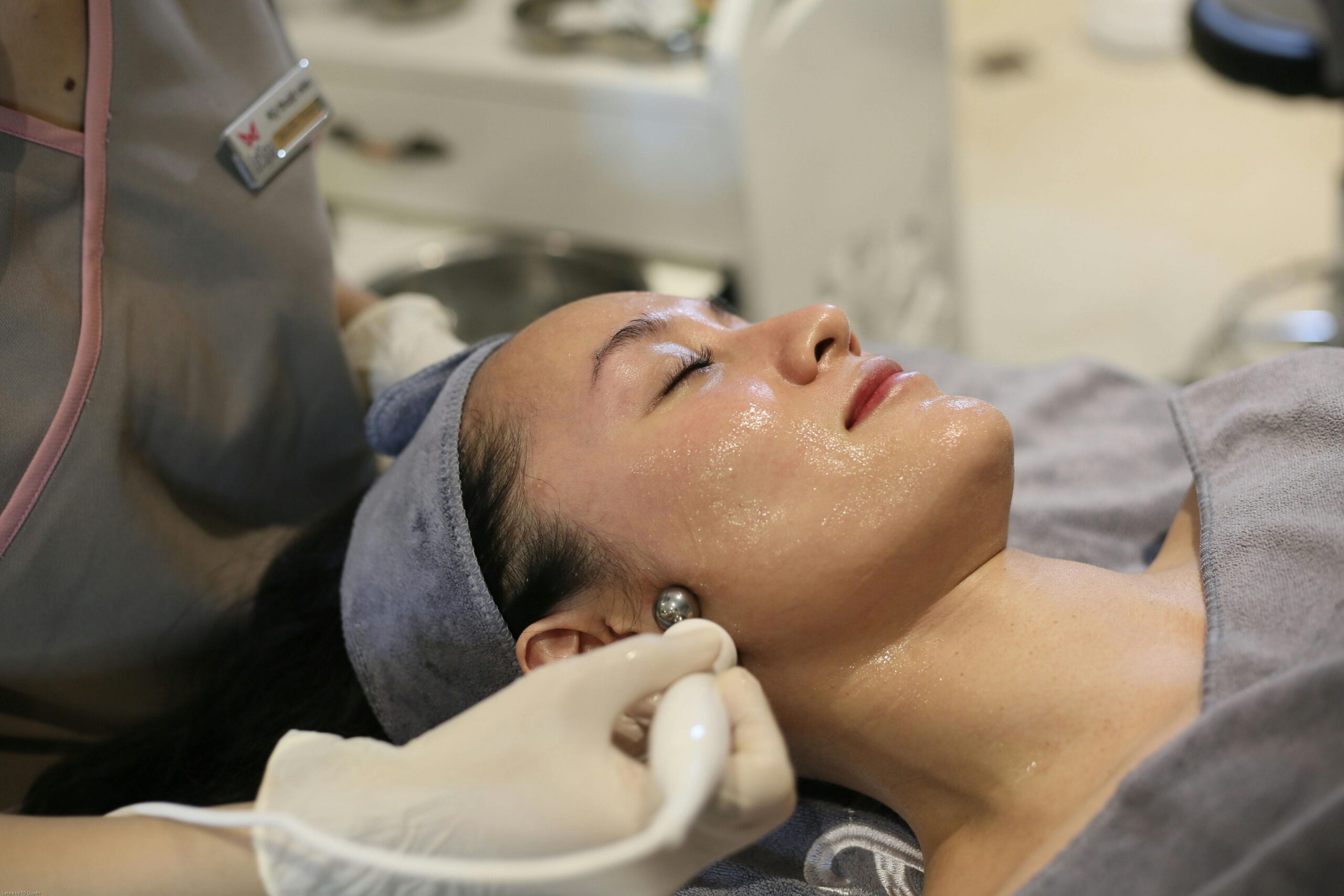 Close-up of a woman receiving skincare treatment in a spa in Hanoi, Vietnam.